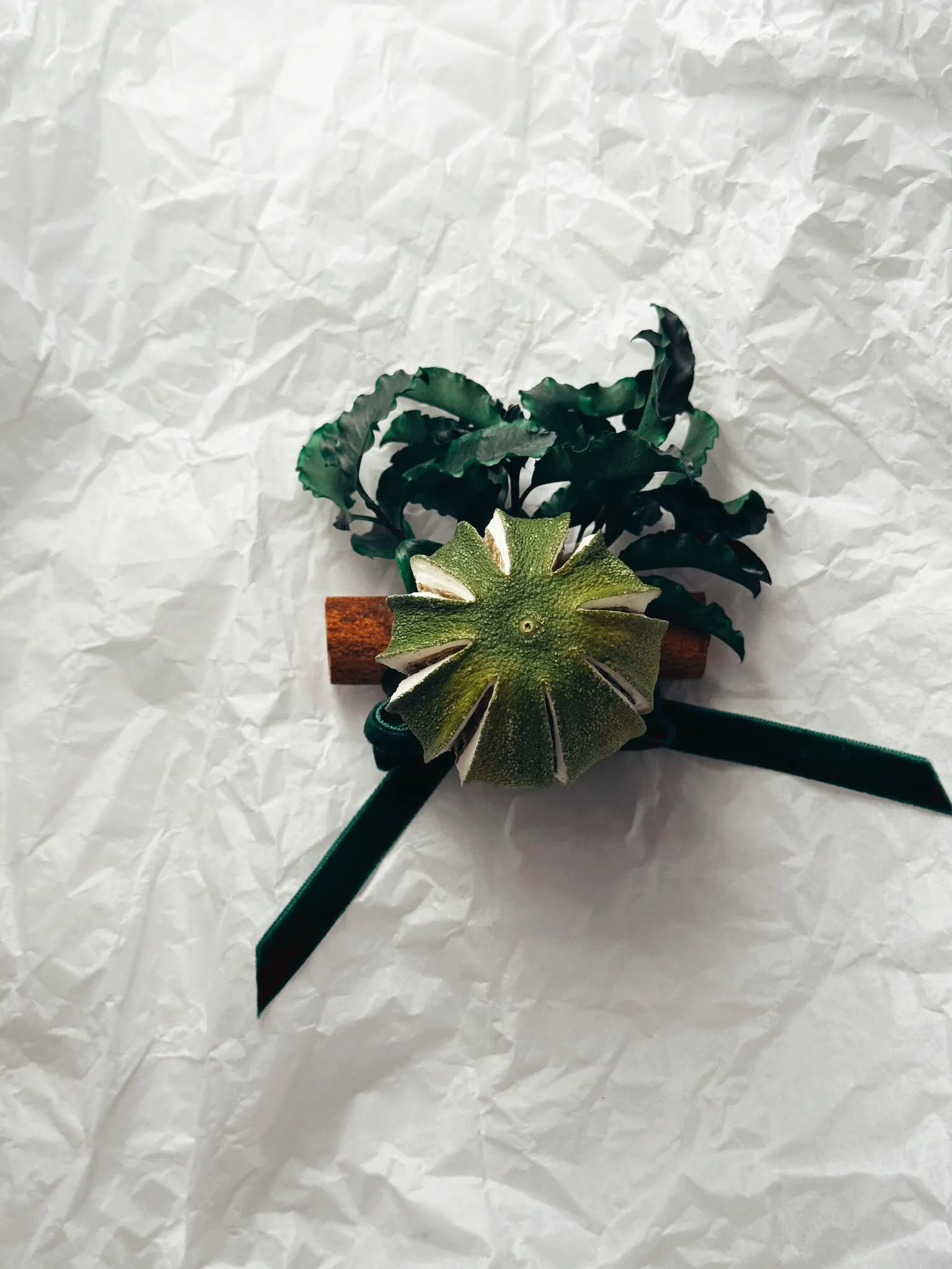 Natural Christmas baubles with dried green oranges, pittosporum foliage and cinnamon sticks with velvet ribbon handmade in London - image 2