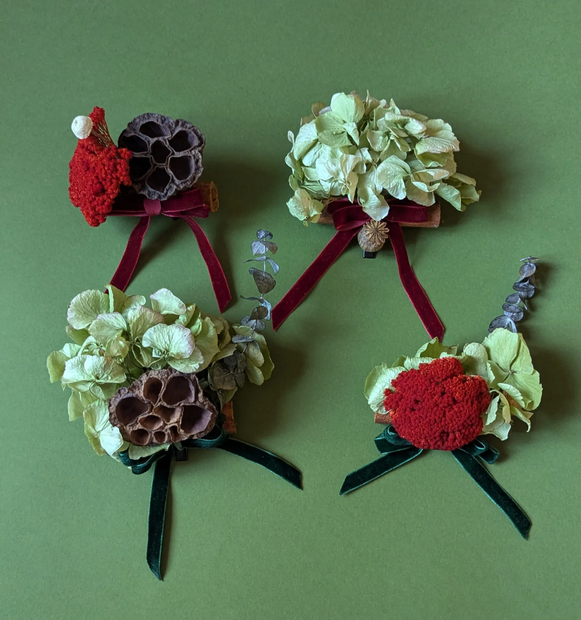 Natural Christmas baubles with dried hydrangea, lotus pods and red yarrow with velvet ribbon handmade in London